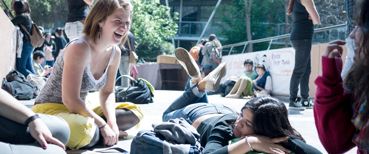 IMG: Students relaxing near library while we work.